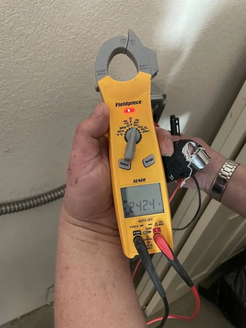 Voltage testing with clamp meter during Ceiling Fan Installation in Higginsville